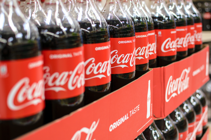 Coca Cola Bottles On A Shelf